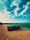 Vertical shot of an old boat on the shore in Sevan Lake, Armenia Royalty Free Stock Photo