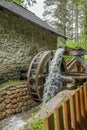 Vertical shot of an old building a water mill in Slovenia Royalty Free Stock Photo