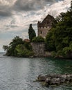 Vertical shot of the old castle near the coast on a clouded day