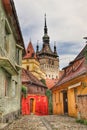 Vertical shot of the old clock tower in Sighisoara, Romania Royalty Free Stock Photo