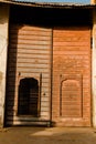 Vertical shot of an old gate with two knockers, in Mandawa haveli Rajasthan India