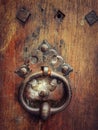 Vertical shot of an old handle door knob on a wooden door number 5 Royalty Free Stock Photo