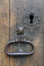 Vertical shot an old metal door knocker with a keyhole on the side Royalty Free Stock Photo