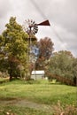 Vertical shot of an old metal farm windmill Royalty Free Stock Photo