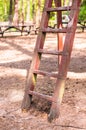 Vertical shot of an old rusty ladder with a blurred background Royalty Free Stock Photo