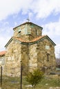 Vertical shot of an old stone church under a blue sky in Kavtiskhevi, Georgia Royalty Free Stock Photo