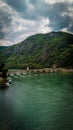 Vertical shot of an old stone-made Mehmed Pasa Sokolovic Bridge over a Drina river