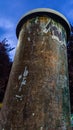 Vertical shot of an old stone water tower at dawn Royalty Free Stock Photo