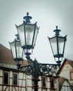 Vertical shot of old streetlights in a city Royalty Free Stock Photo