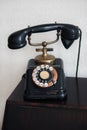 Vertical shot of an old telephone on a white background Royalty Free Stock Photo