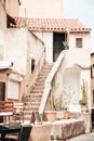 Vertical shot of an old typical Corsica house with stairs Royalty Free Stock Photo