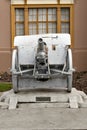 Vertical shot of an old white cannon at the museum outdoors Royalty Free Stock Photo