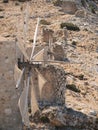 Vertical shot of old windmills in Crete, Greece Royalty Free Stock Photo