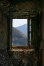 Vertical shot of an old window of an abandoned building in a ghost town Royalty Free Stock Photo