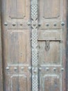 Vertical shot of an old wooden closed door Royalty Free Stock Photo