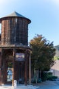Vertical shot of an old wooden water tower - early morning