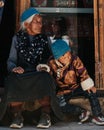 Vertical shot of old and young Tibetan Buddhist worshipers at the Tiji Festival in Lo Manthang