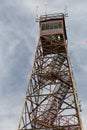 Vertical shot of the Olson Tower under a cloudy sky in West Virginia