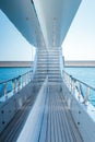 Vertical shot from the onboard of a white yacht sailing in the sea Royalty Free Stock Photo