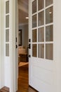 Vertical shot of an open, wooden front door