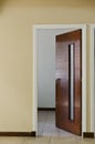 Vertical shot of an opened door of a room Royalty Free Stock Photo