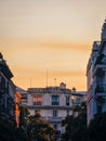 Vertical shot of an orange sunset above french tenement houses.