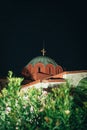 Vertical shot of an Orthodox church in a small tourist town of Pefkochori, Greece at night Royalty Free Stock Photo