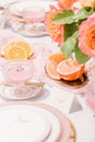 Vertical shot of an outdoor wedding table with flowers and elegant tableware Royalty Free Stock Photo