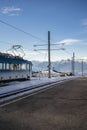 Vertical shot of an overhead line beside railway of an electric train under a clear blue sky Royalty Free Stock Photo