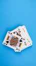 Vertical shot of a pack of playing cards isolated on a blue background Royalty Free Stock Photo