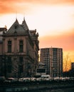 Vertical shot of the Palace of Justice in Bucharest against a sunset sky