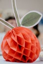 Vertical shot of a paper apple with a blurred background Royalty Free Stock Photo