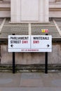 Vertical shot of the Parliament Street, and Whitehall SW1 road sign in London, the UK