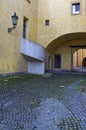 Vertical shot of a part of a yellow textured in a city of europe