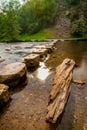 Vertical shot of the Peak District National Park with step stones in the river Royalty Free Stock Photo