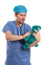 Vertical shot of a pediatric doctor using a stethoscope on a teddy bear