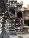 Vertical shot of people at Angkor temple views and authentic cultural spots in Cambodia