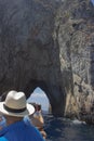 Vertical shot of people on a cruising yacht on Capri Island in Naples, Italy Royalty Free Stock Photo