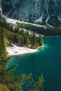 Vertical shot of people enjoying the turquoise water of Baires Lake in the Dolomites, Italy Royalty Free Stock Photo