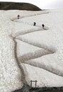 Vertical shot of people hiking up the mountain Royalty Free Stock Photo