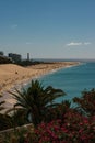 Vertical shot of people relaxing on sandy beach Royalty Free Stock Photo