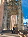 Vertical shot of people on the stairs of the late Gothic portal of Albi Cathedral. France.