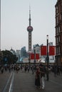 Vertical shot of people on the streets of Shanghai on a national day