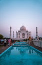 Vertical shot of the people at the Taj Mahal at sunrise in Agra, India