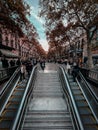 Vertical shot of people walking the La Rambla street in Barcelona, Spain