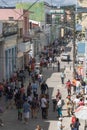 Vertical shot of people walking in a middle street in Matanzas, Cuba