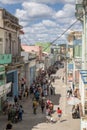 Vertical shot of people walking in a middle street in Matanzas, Cuba