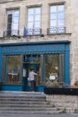 Vertical shot of a person entering the building of the Compagnons du Devoir in Paris, France