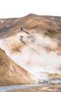 Vertical shot of person walking on trail over Kerlingarfjoll mountain of Hveradalir hot springs