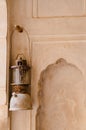 Vertical shot of a petromax kerosene lantern hang on the door of a Buddhist building
